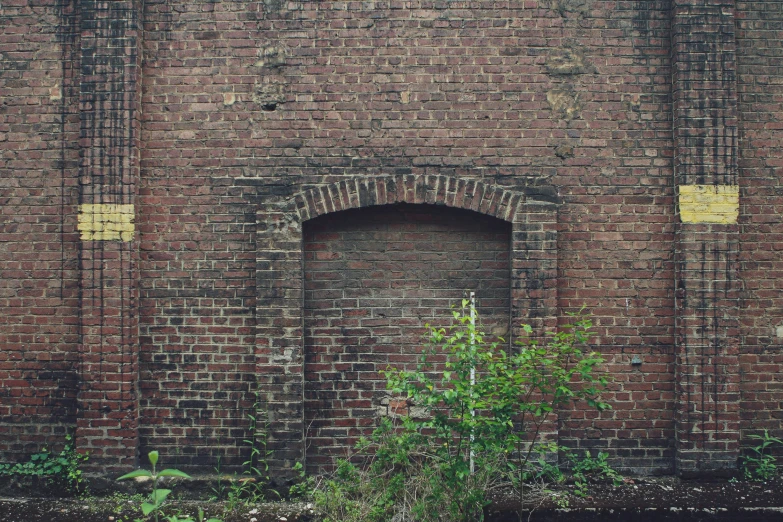 a brick building with a round window and some trees