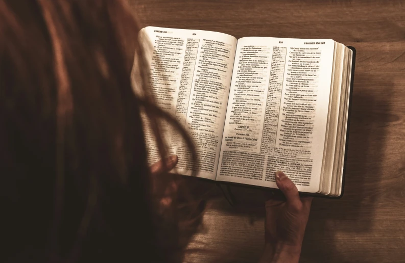 someone reading a book with many words and phrases