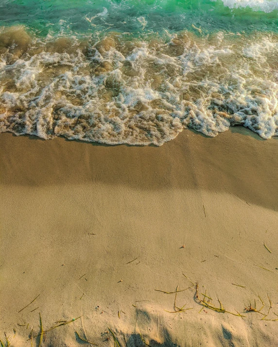 a po taken from above of the beach at an ocean shore