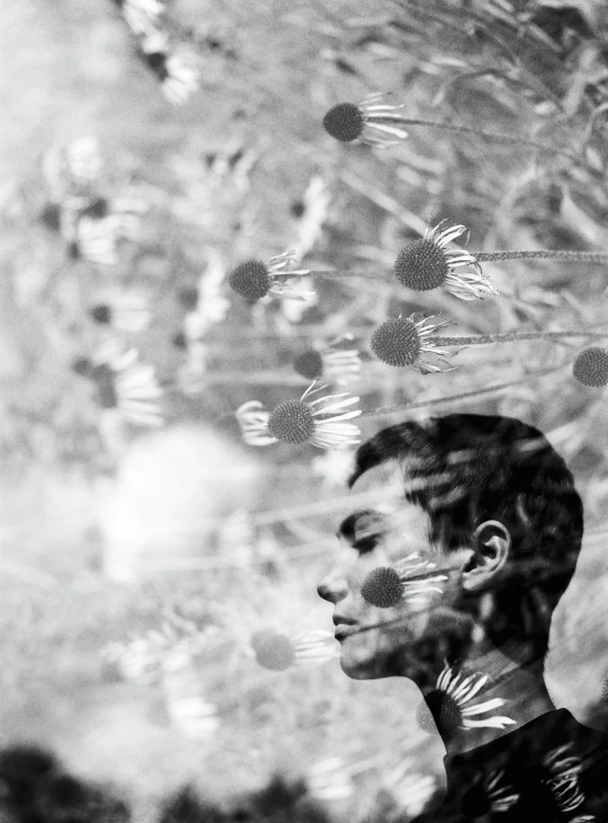 a person standing with their head behind the glass