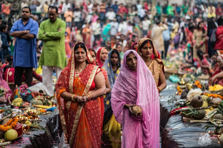 a group of women in colorful indian sari