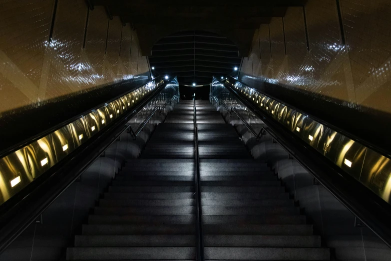 stairs lit up inside an underground metro station