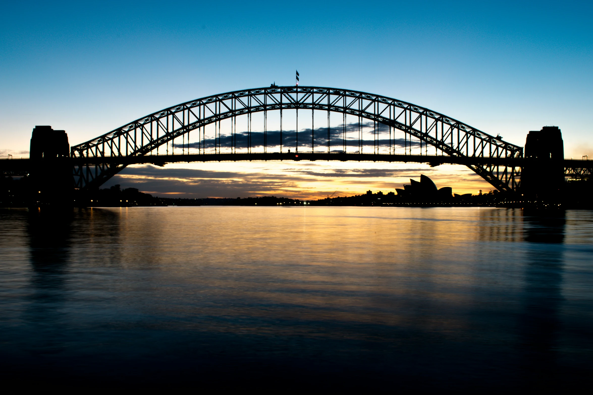 a very nice bridge going across a lake