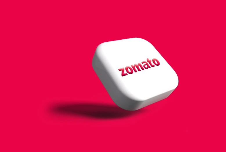 a dice shaped like the word zomattoo sitting in a square
