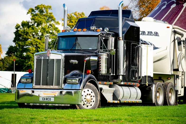 the cab of a tractor trailer driving in a park