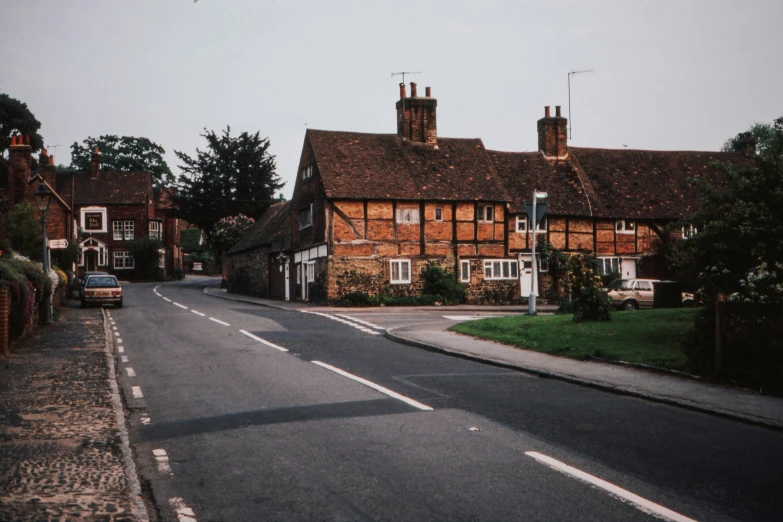 a small street in front of some brown brick buildings