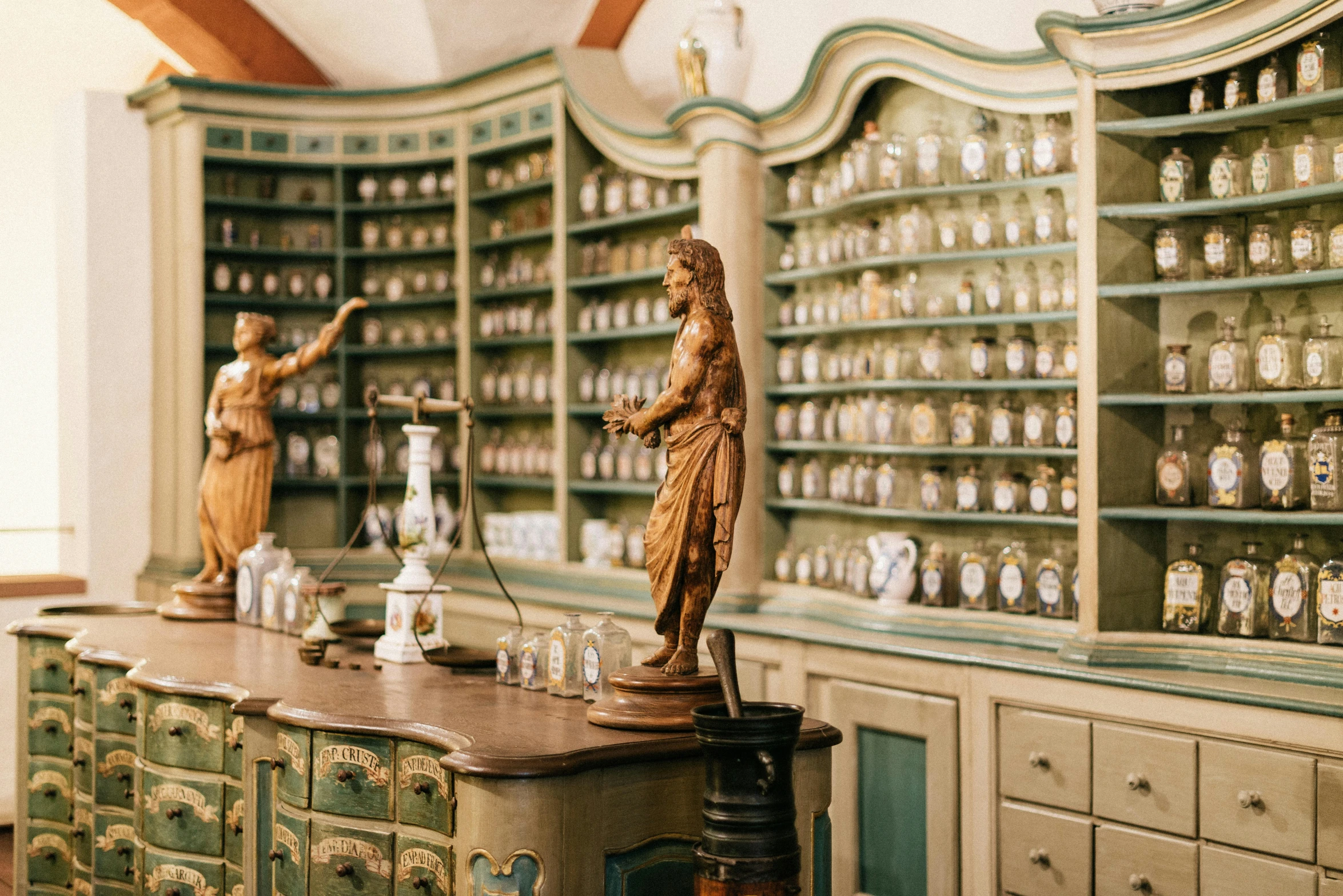 two sculptures on display in the middle of a room