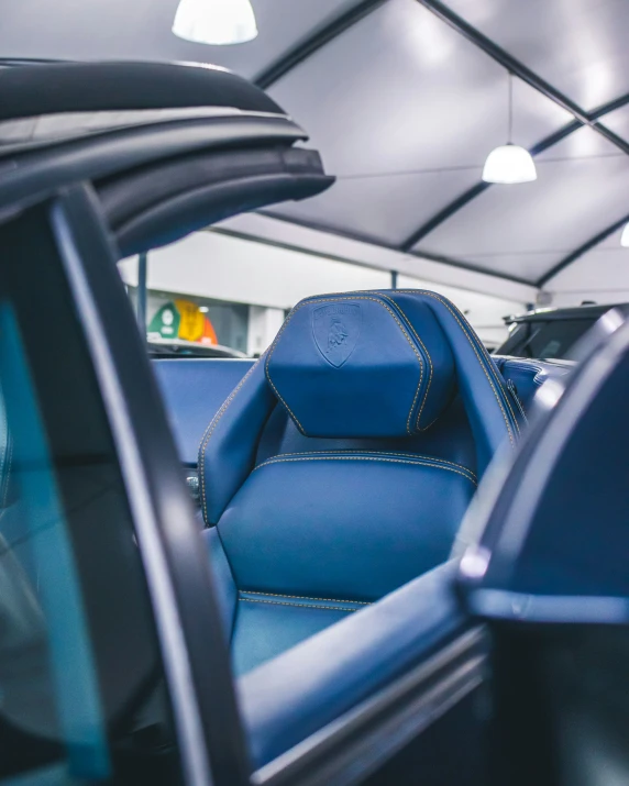 the blue seat of a car at a showroom