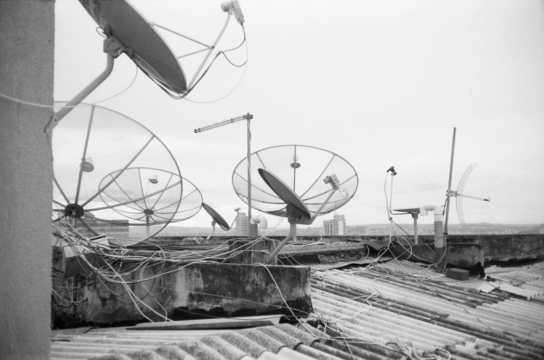 several satellite dishes are in a row