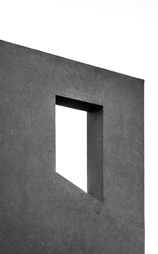 a white wall with an open window and a square in the wall