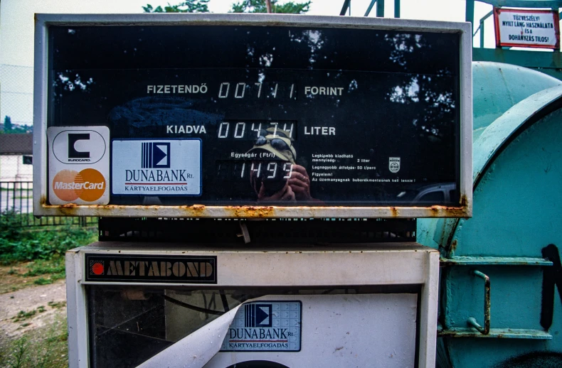 an old machine with some stickers on it