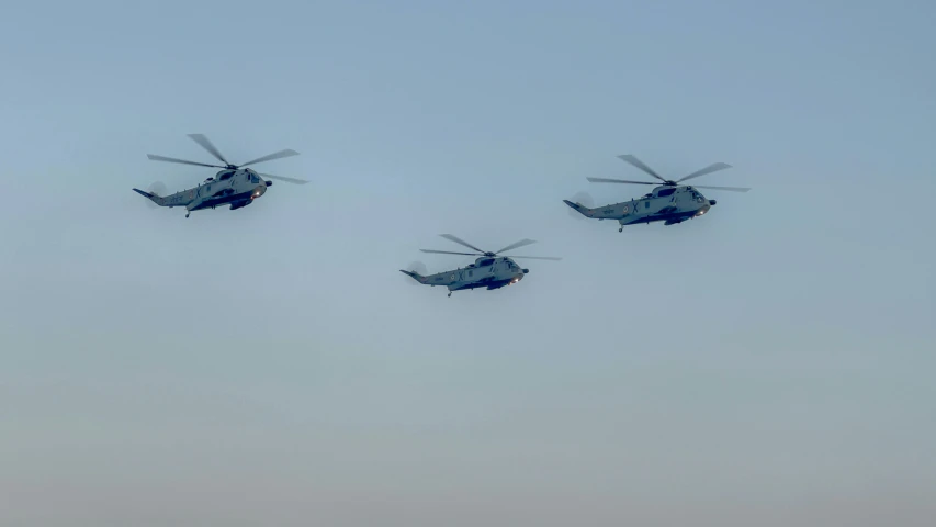 four air planes flying in formation through the sky