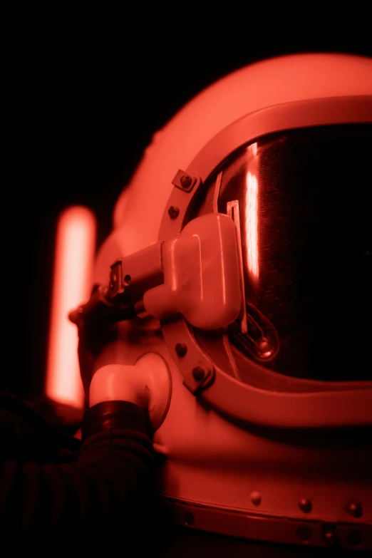 a close up of a white space suit and a light in it