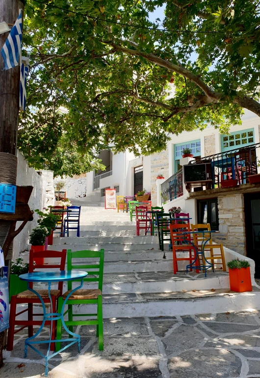 the street is lined with tables and chairs