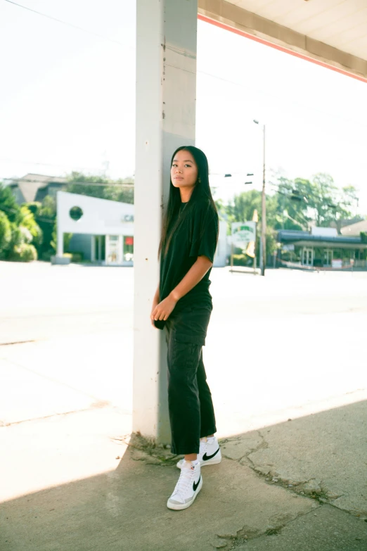  leaning against a pillar in the sun