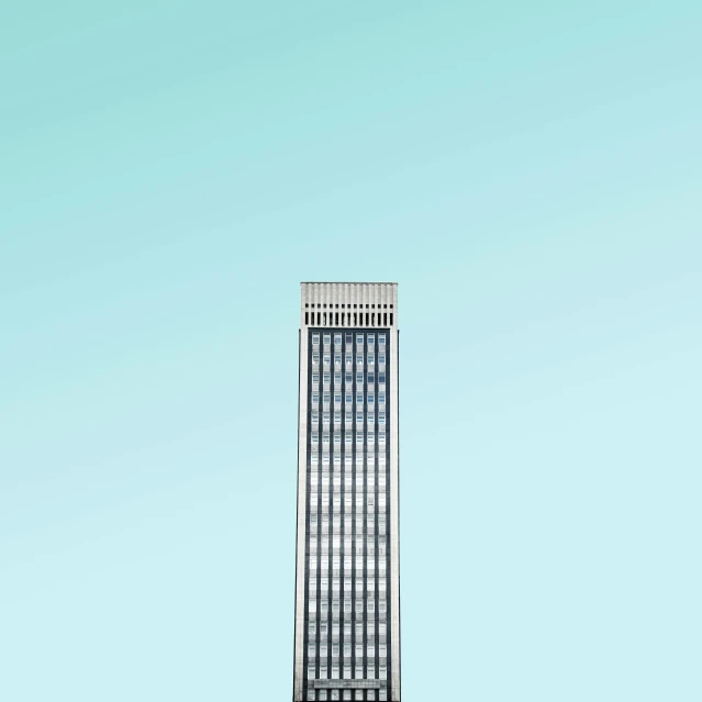 a tall building sits in the sky on a bright day