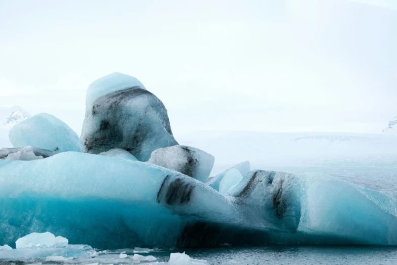 a frozen lake in the arctic with ice floating around