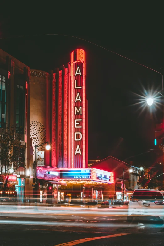 the light shines brightly in front of some large building