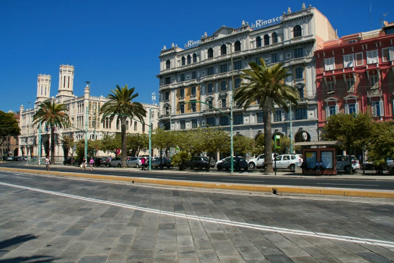 a city street with tall buildings on either side