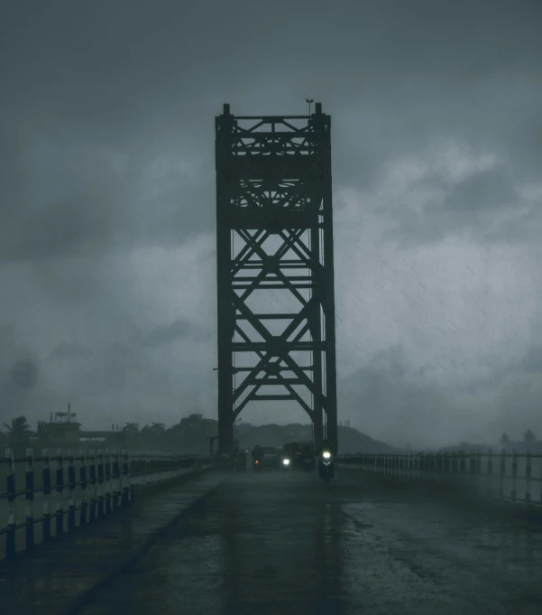 a railroad crossing on a wet road with dark clouds