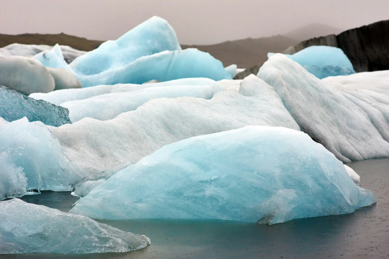 large chunks of ice on a table covered in snow