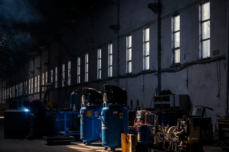 blue and yellow pipes in front of some windows