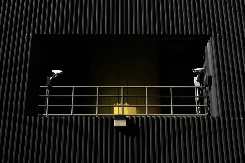 a couple of lights are seen on a balcony