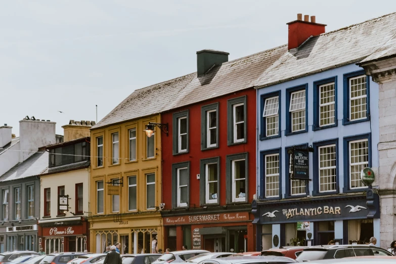 many different colored buildings line the city street