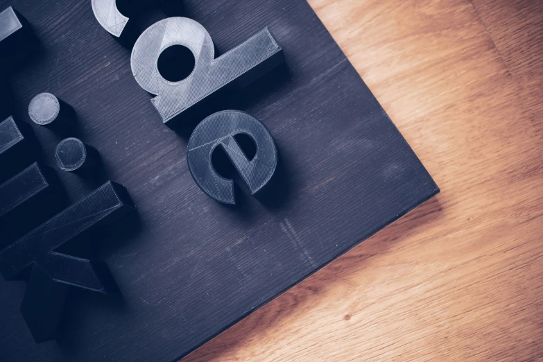 a table topped with cut wooden letters spelling out the numbers