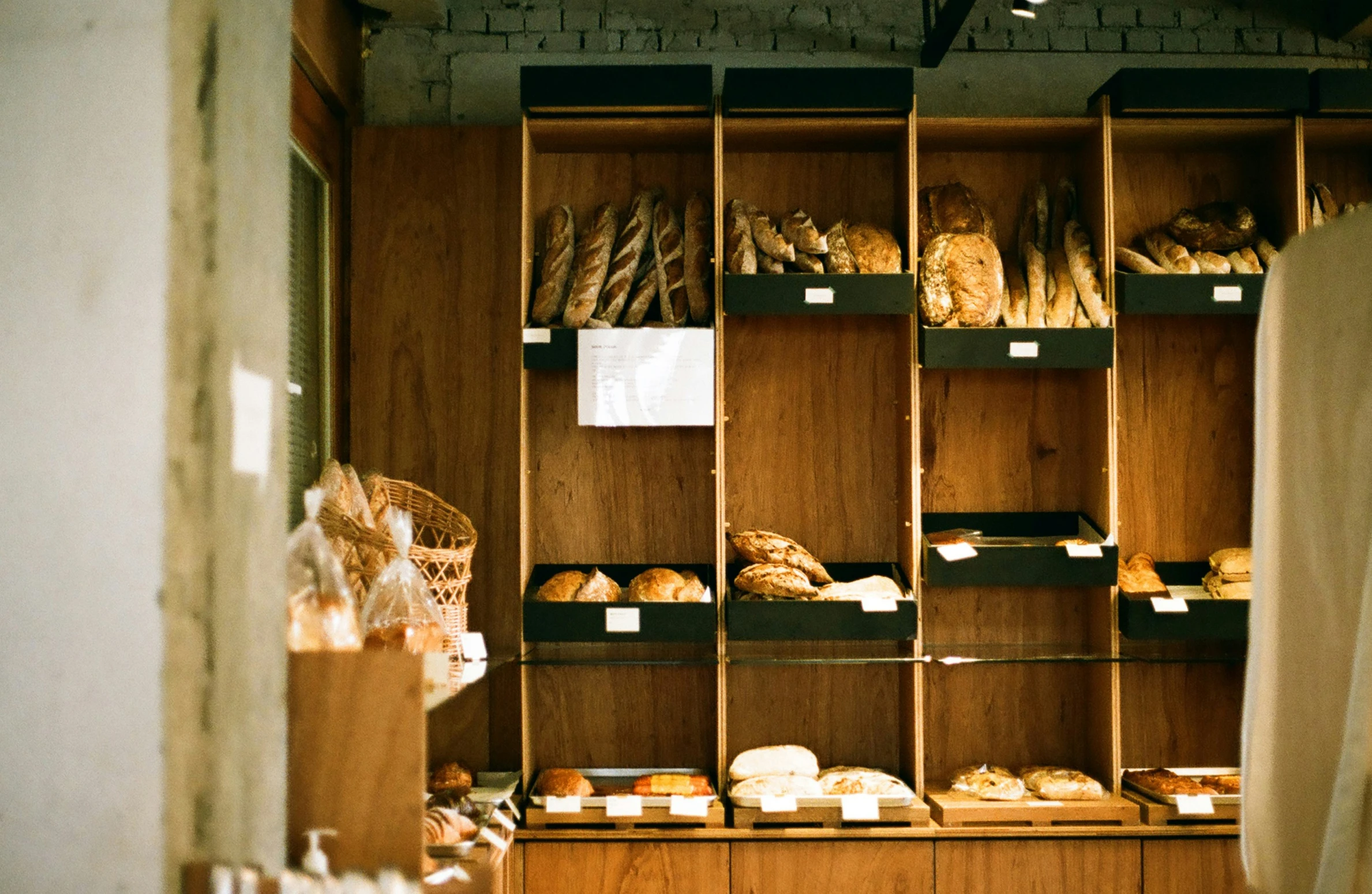 the bakery is filled with many fresh baked goods