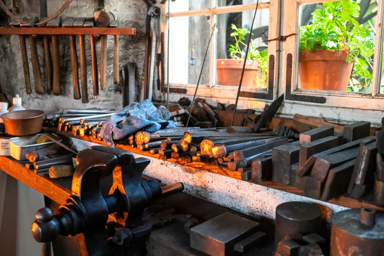 many tools are sitting on a table next to an open window