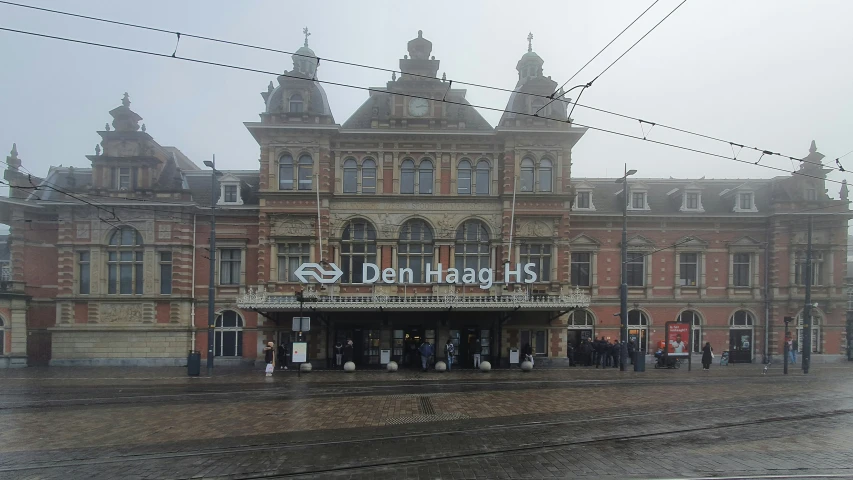 a group of people that are standing in front of a building