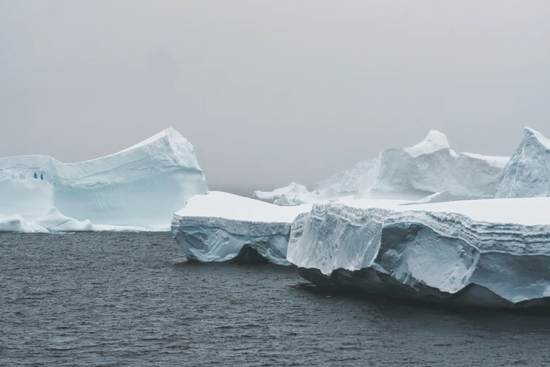 a couple of large icebergs floating next to each other
