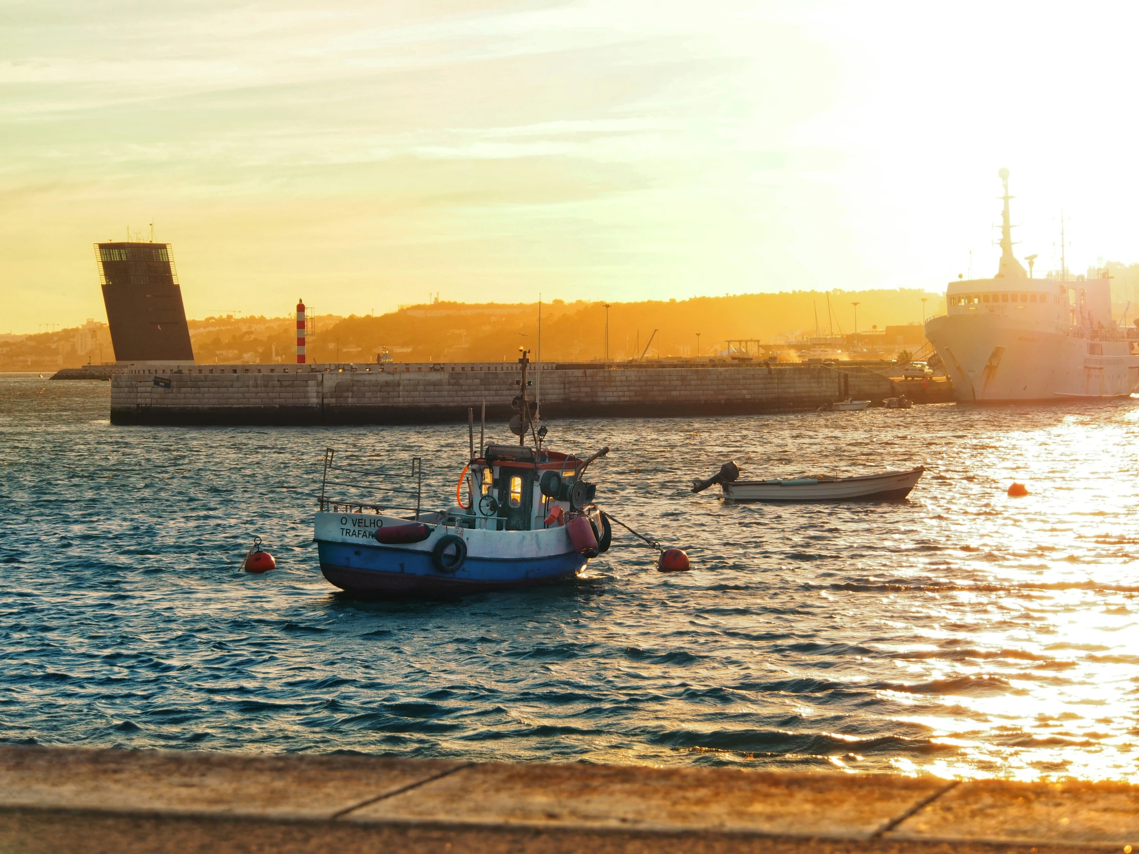 the boats are on the water by the shore