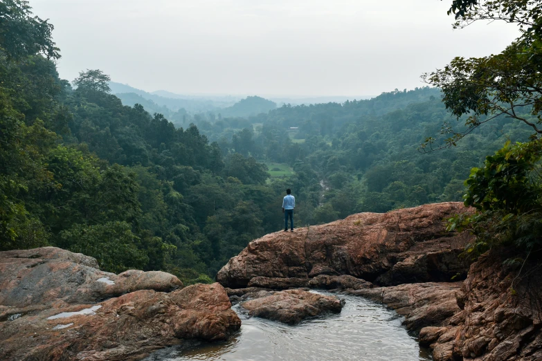 a person that is standing near some water