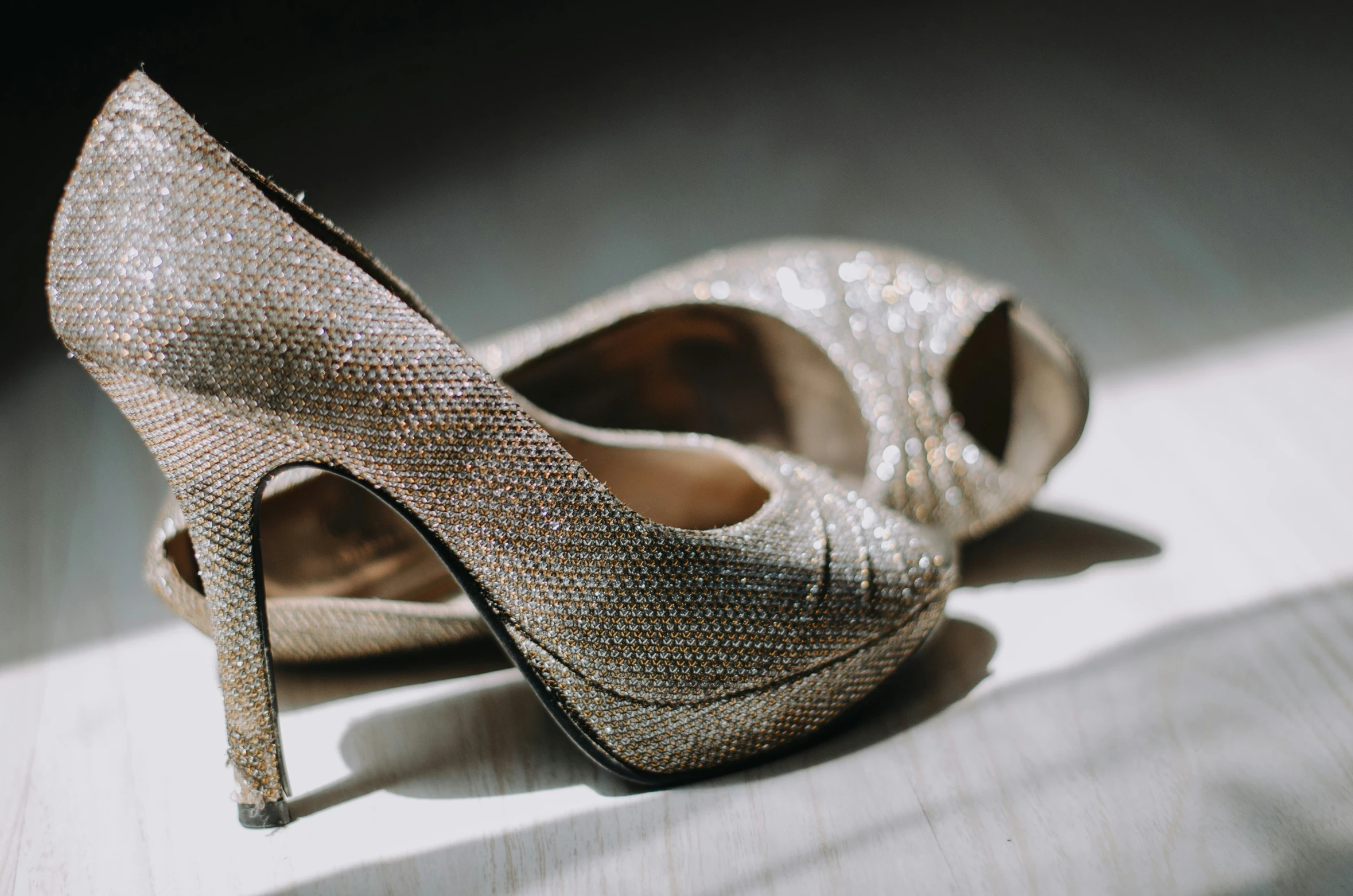 a pair of shoes are sitting on a white surface