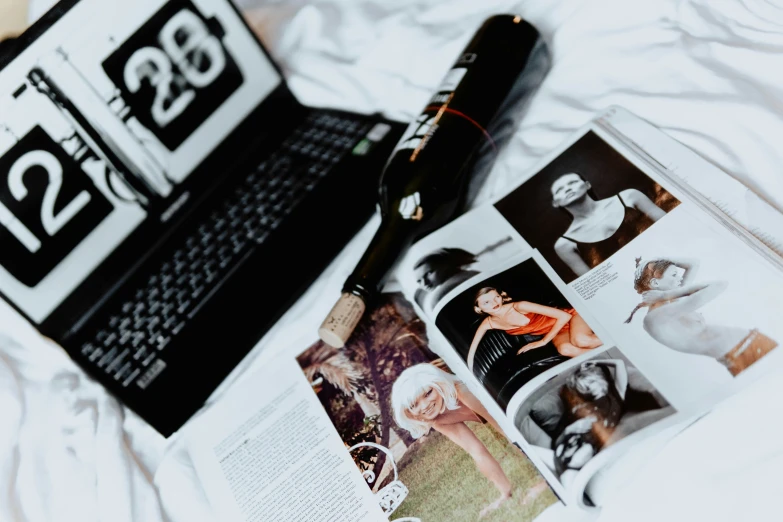 an open magazine and a lighter sit on the bed