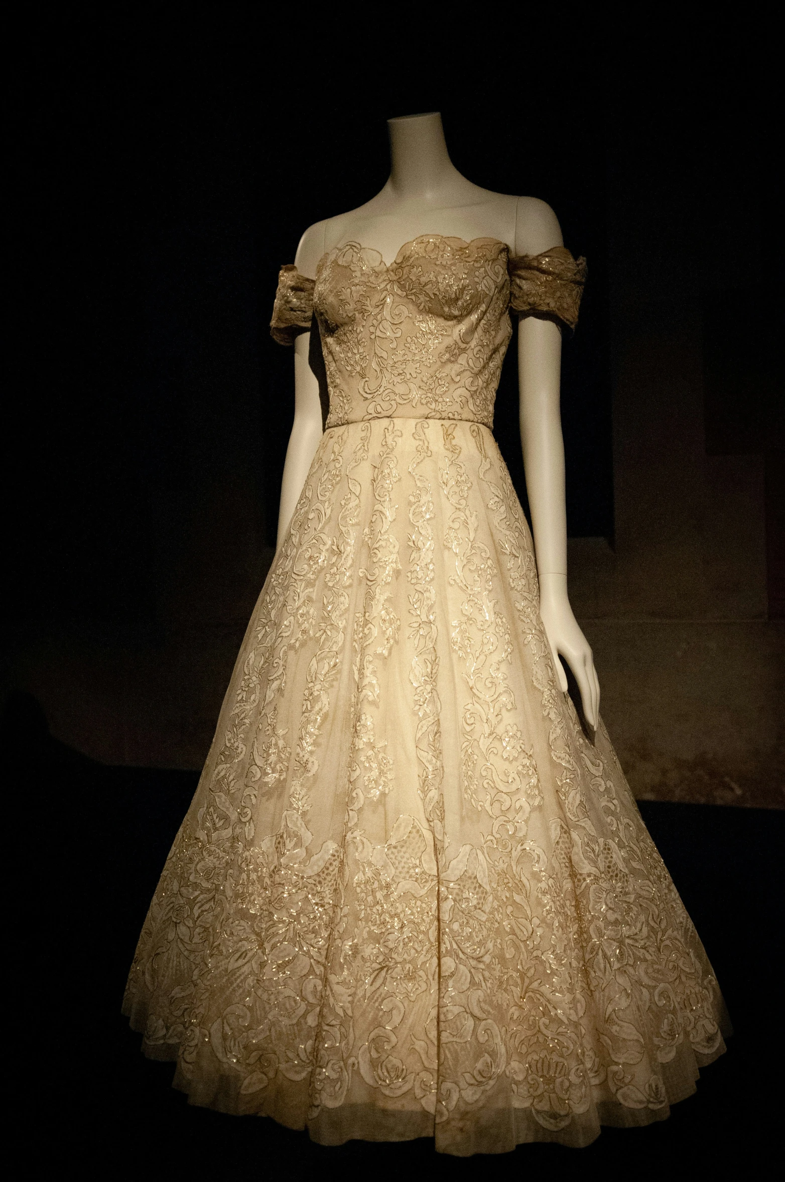 a dress designed by elizabeth butler and worn with yellow, on display at the smithsonian