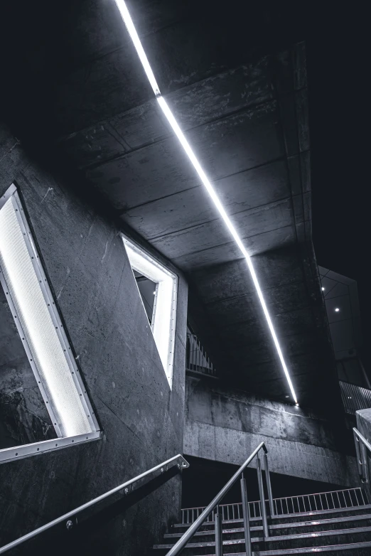 a dark hallway leading to an indoor structure with stairs