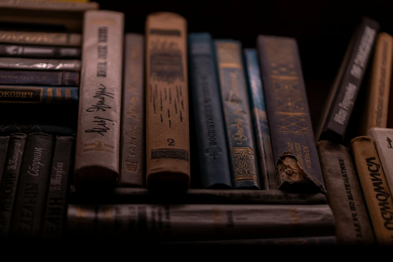 several books in front of some books on top of each other