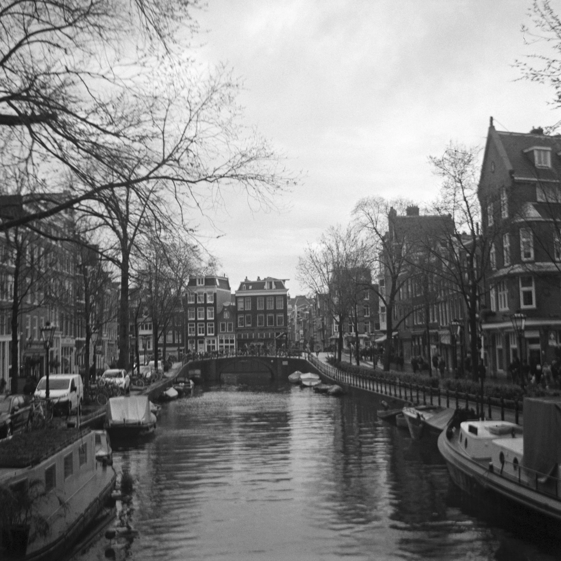 a waterway with boats traveling in it next to buildings