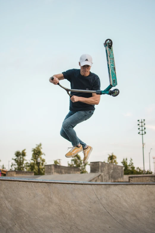 man doing skateboard stunts on his skate board ramp