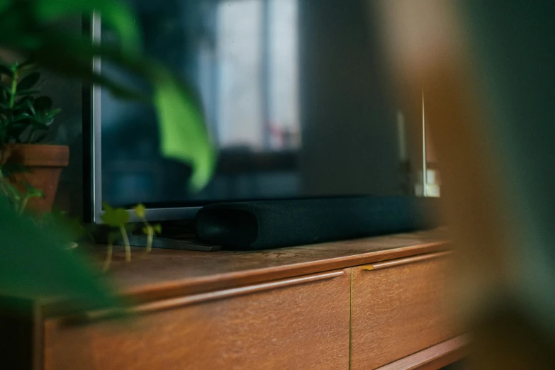 the computer monitor sits on top of the wooden desk