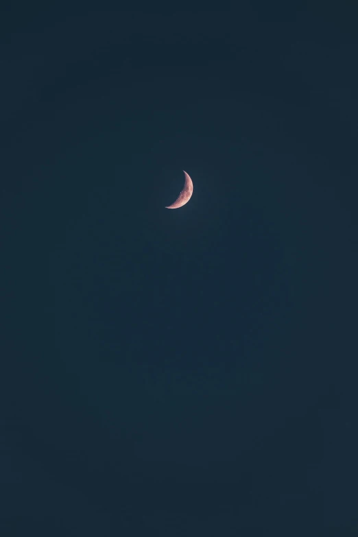 a crescent moon and a black sky background