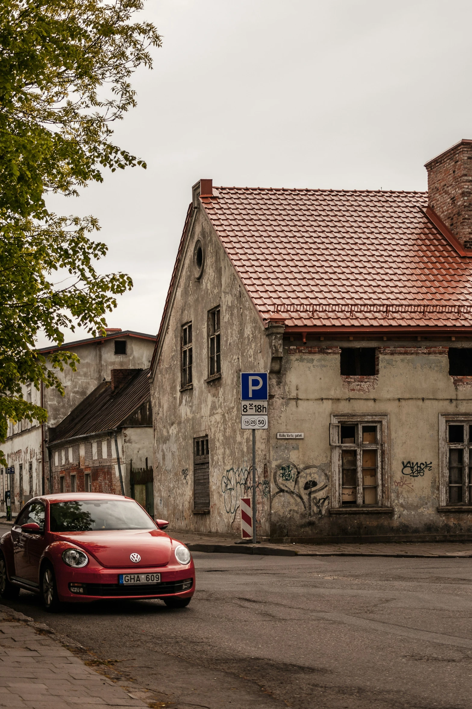 a car is parked in front of a building