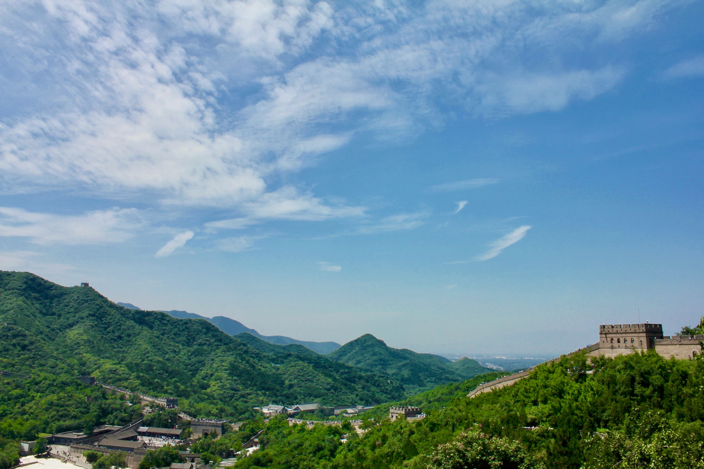 mountains and the sky with some clouds above them