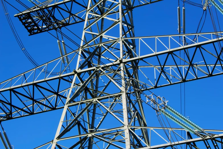 an electrical pole against the blue sky is a very unusual sight