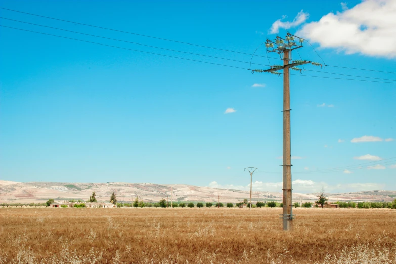 an empty field with a telephone pole on top