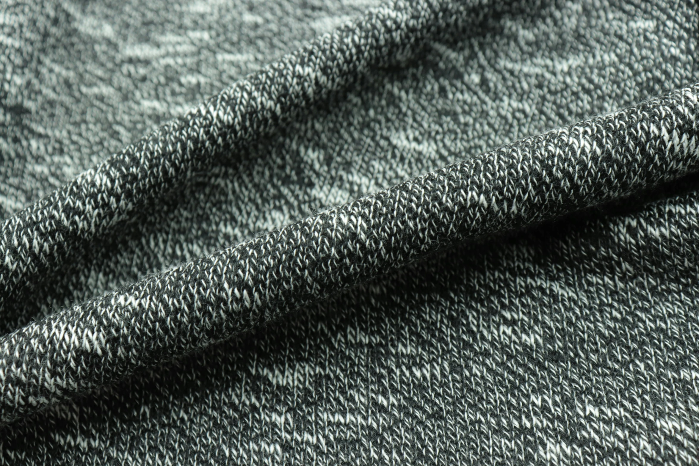 a po of grey fabric, textured with small details