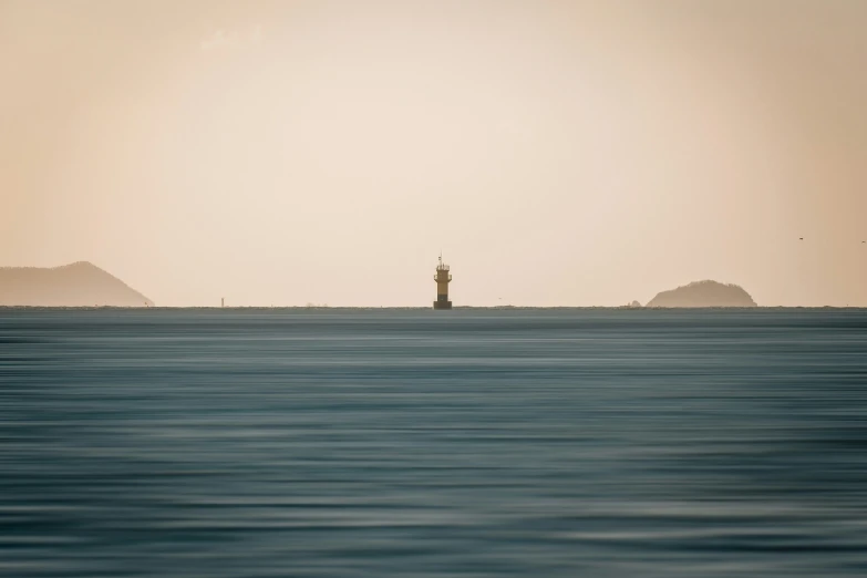 an island with a sailboat sitting in the middle of it